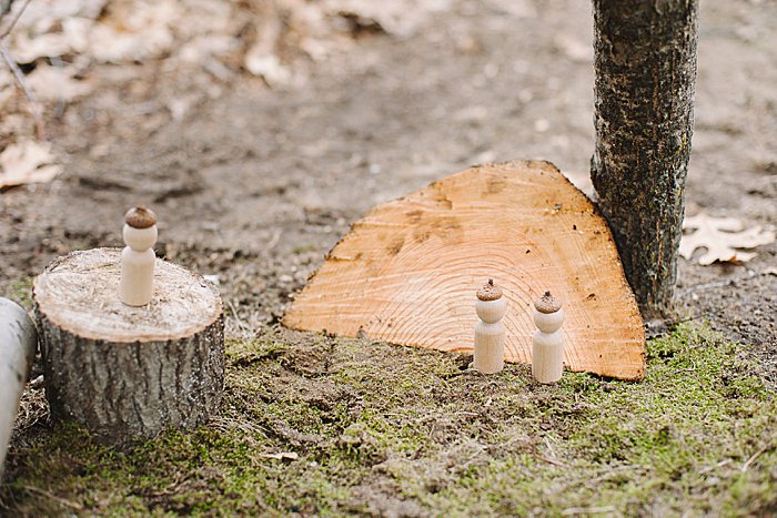 wooden peg people with acorn hats hot glued on for the nature house